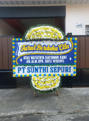 Papan Bunga Duka di Bina