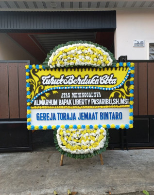 Papan Bunga Duka di Bina